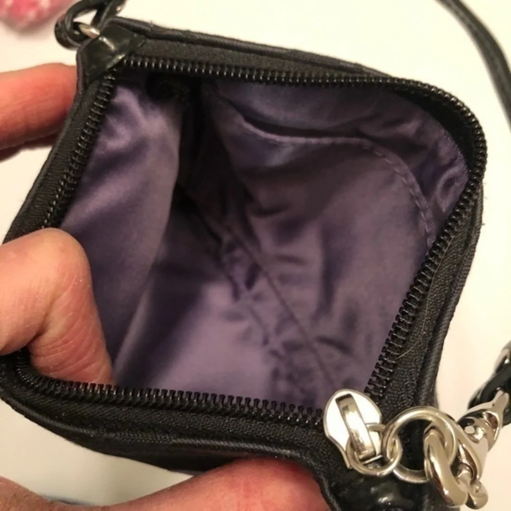 Coach black signature appliqué wristlet clutch
